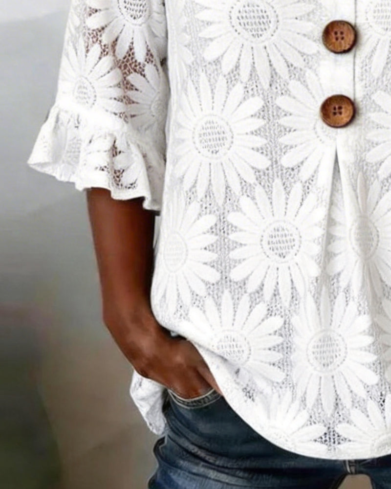 Blusa con estampado de margaritas y volantes