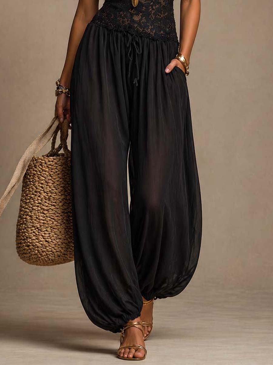 Mono harem de cuello halter en chiffon negro con encaje