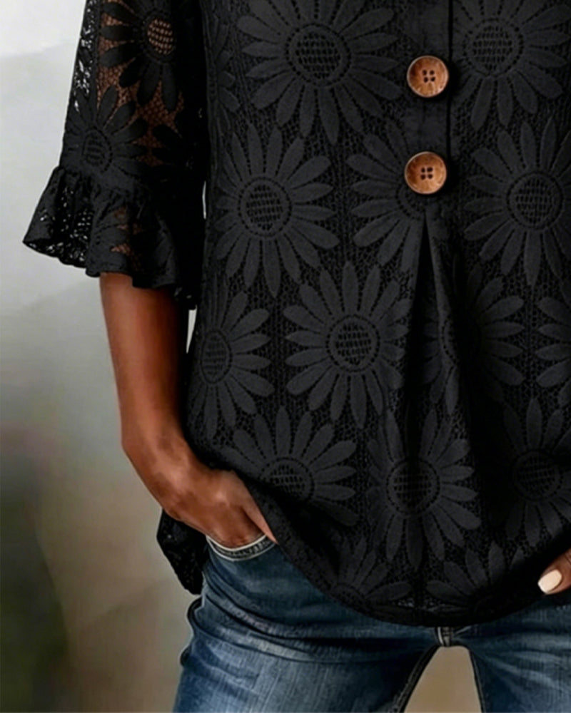 Blusa con estampado de margaritas y volantes