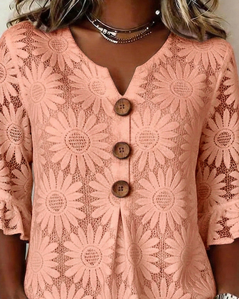 Blusa con estampado de margaritas y volantes