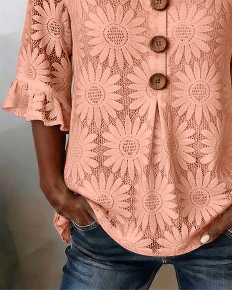 Blusa con estampado de margaritas y volantes