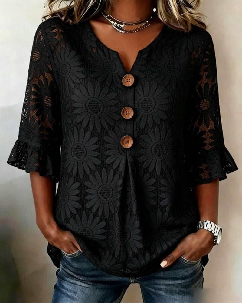 Blusa con estampado de margaritas y volantes