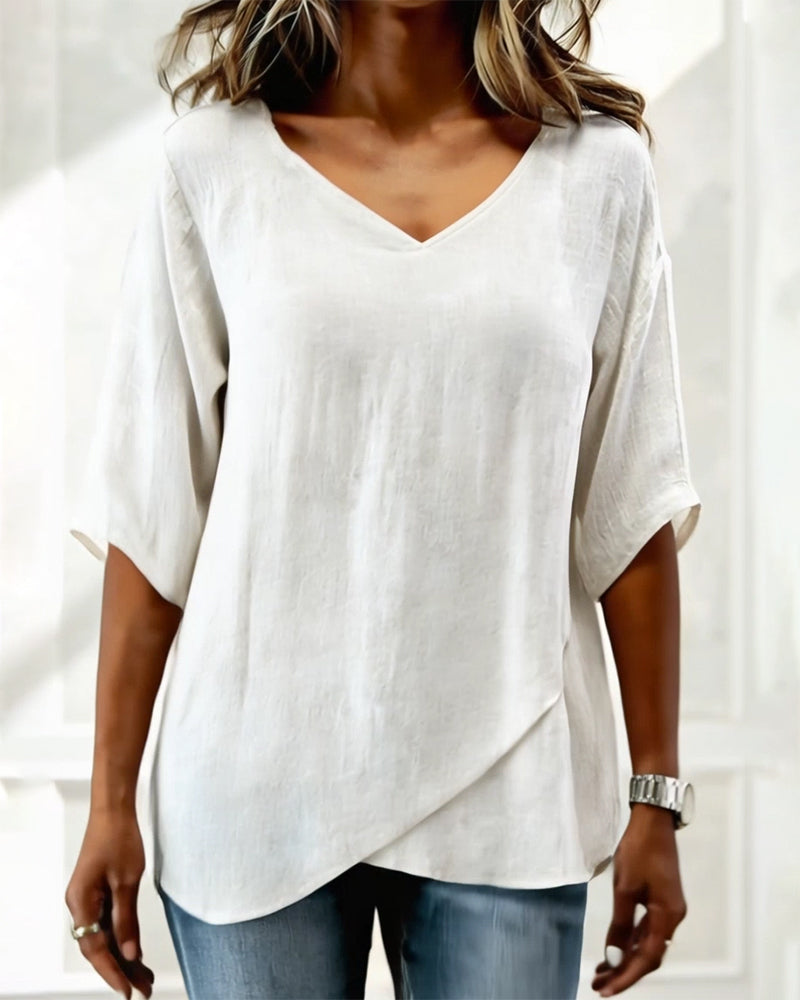 Blusa con dobladillo asimétrico y escote en v