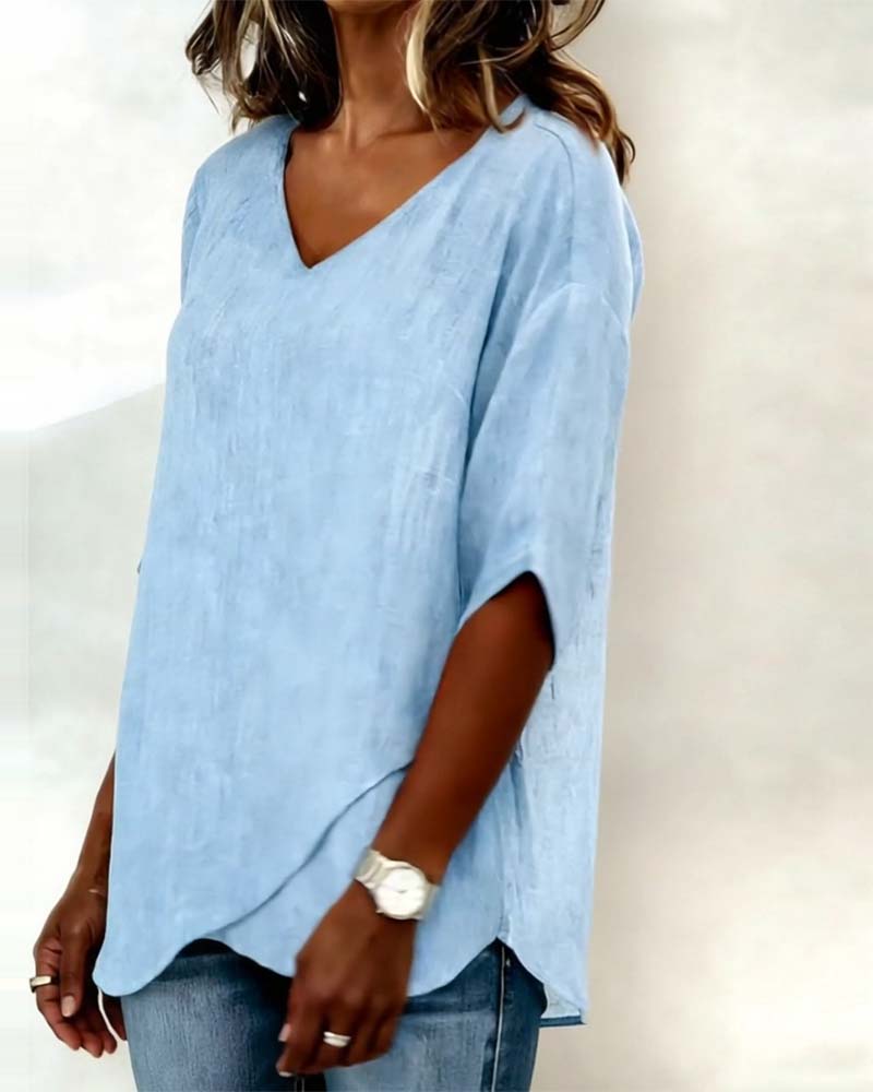 Blusa con dobladillo asimétrico y escote en v