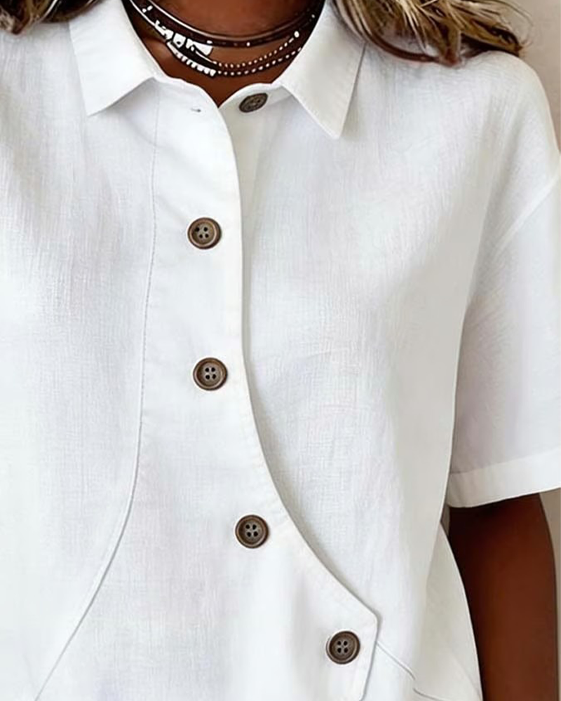 Blusa asimétrica de algodón y lino con botones