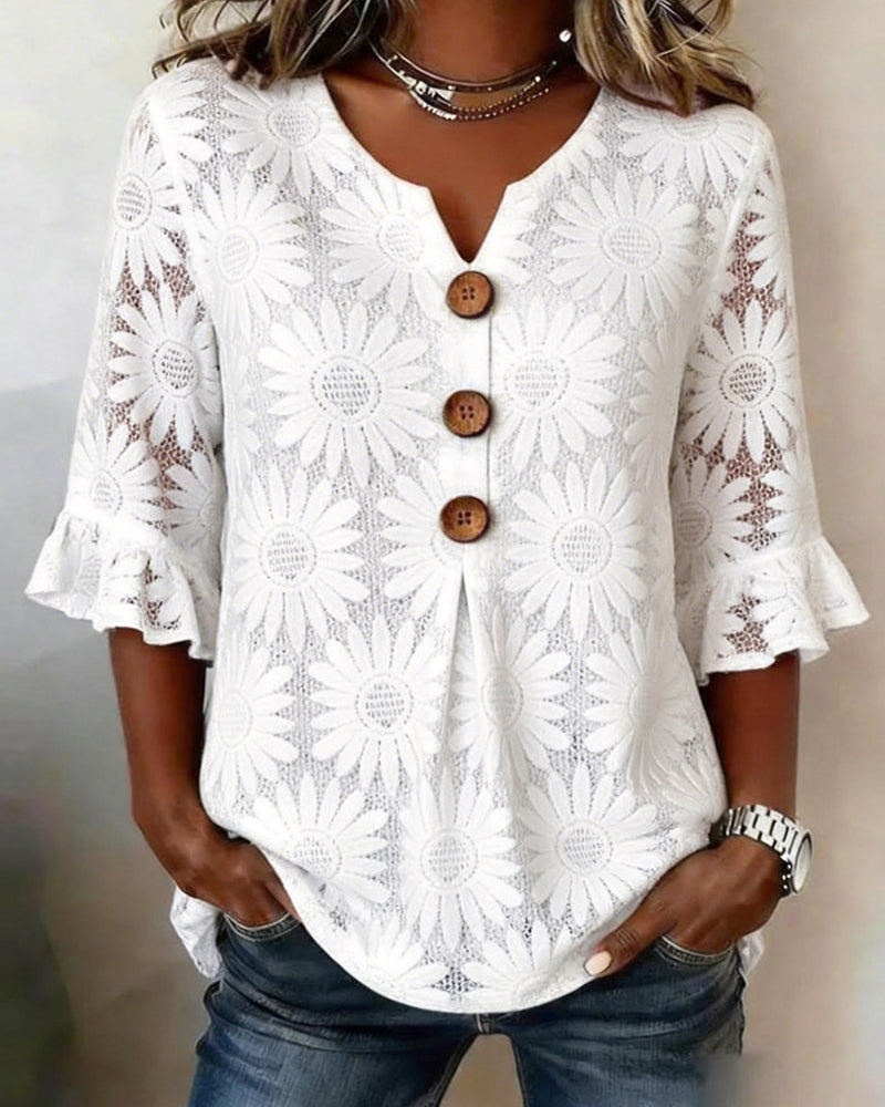 Blusa con estampado de margaritas y volantes