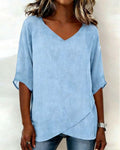 Blusa con dobladillo asimétrico y escote en v