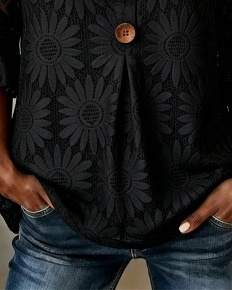Blusa con estampado de margaritas y volantes