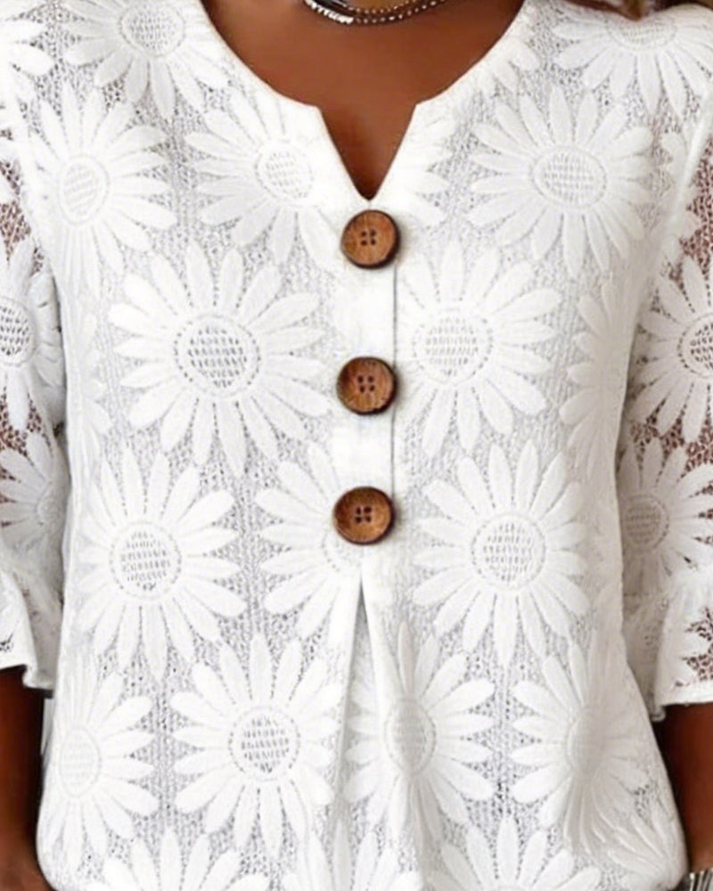 Blusa con estampado de margaritas y volantes